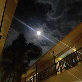 the moon shining amongst the clouds